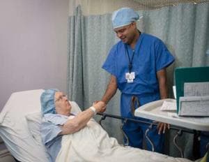 Dr. Nakul Karkare - NY Orthopedic Surgeon looking at a patient history on a computer screen